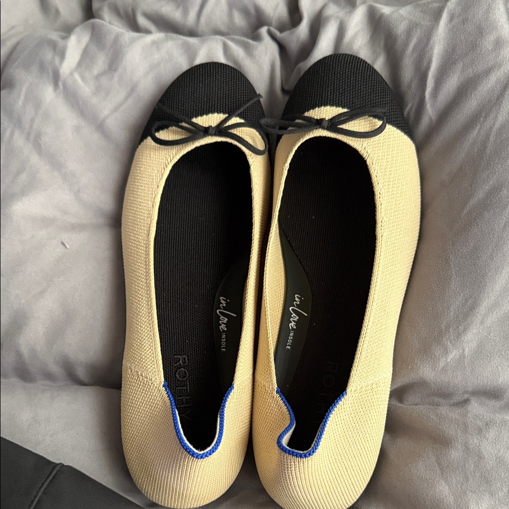 Rothy's Black and Cream Flats with Blue Accent
